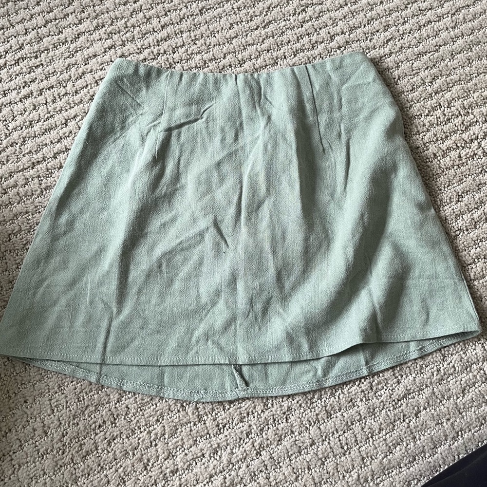green mini skirt